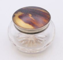 A silver and tortoiseshell dressing table jar. 4 cm high.