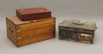 A brass bound trunk, a tin trunk and a vacant canteen. The former 56 cm long.