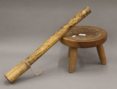 A tribal stool and a club. The club 60 cm long.