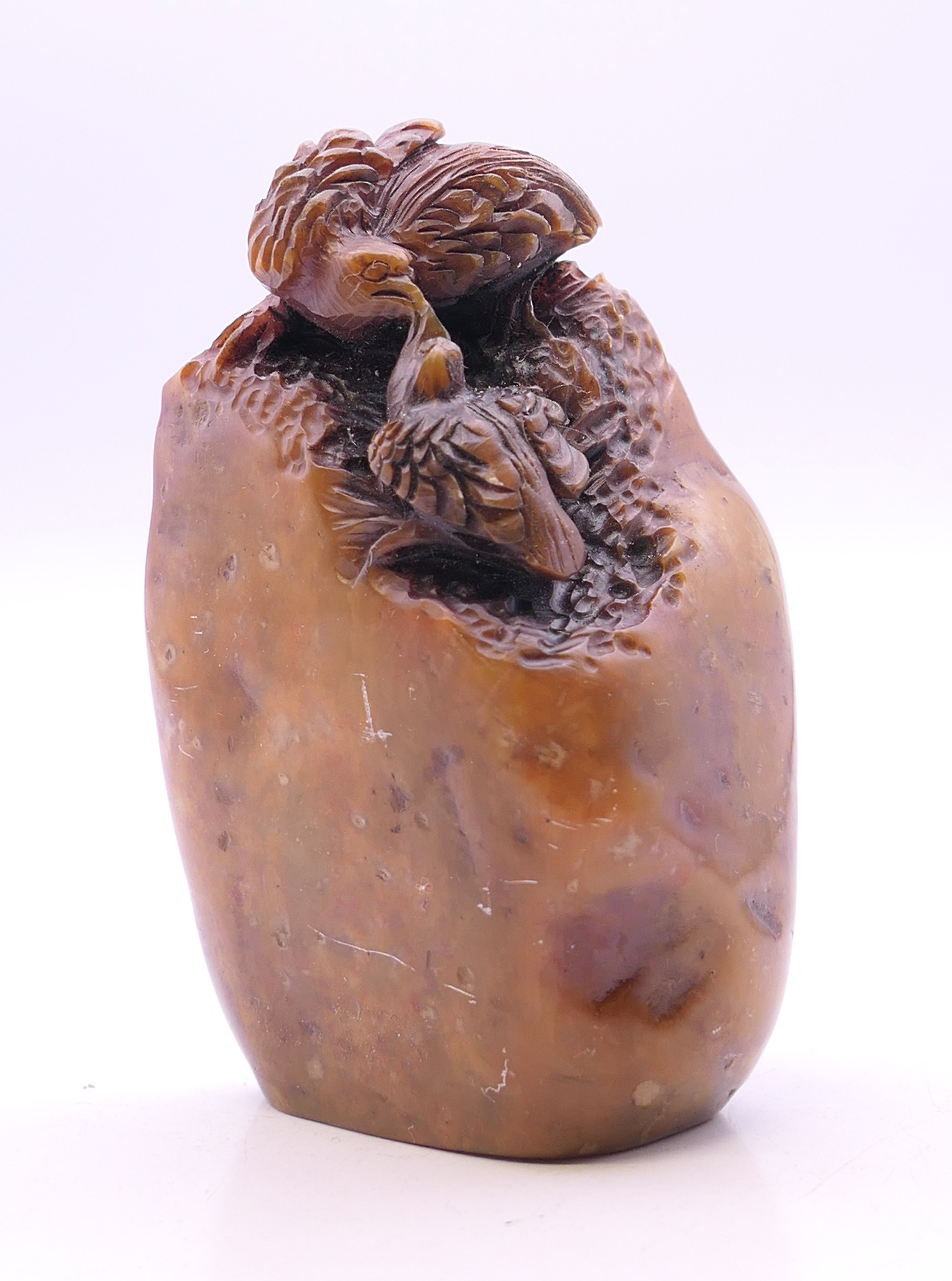 A Chinese soapstone seal carved with birds. 8 cm high.