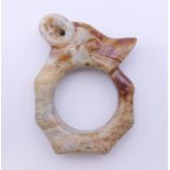 A Chinese white and red jade animal head pendent, Han Dynasty. 6 cm high.