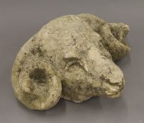 A composite stone model of a ram's head. 31 cm wide.