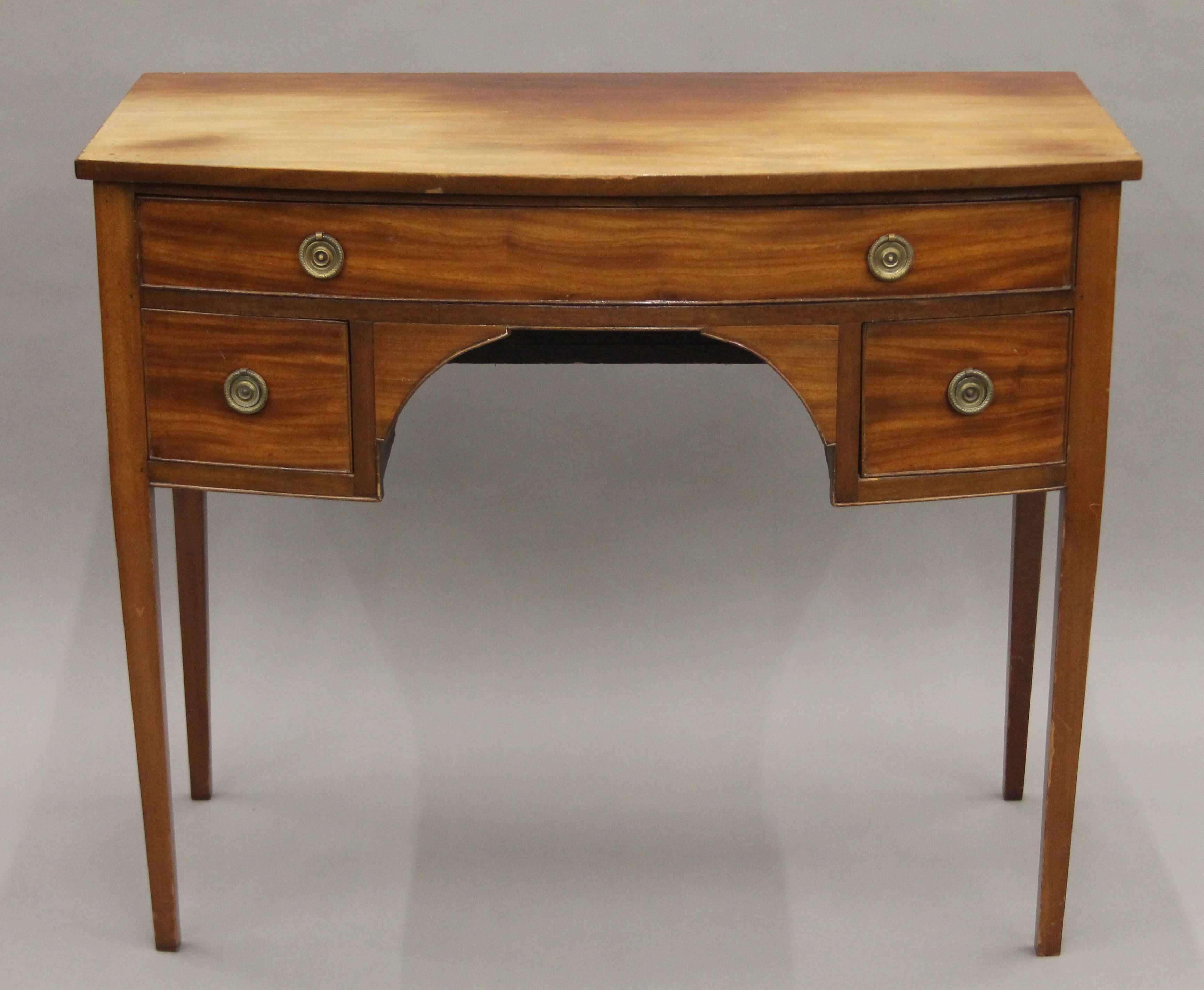 A 19th century mahogany bow front side table. 100 cm wide.