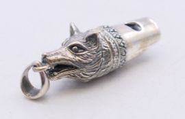 A silver fox mask form whistle. 3.5 cm high.