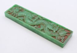 A rectangular jade scroll weight. 16.5 cm x 4.5 cm.