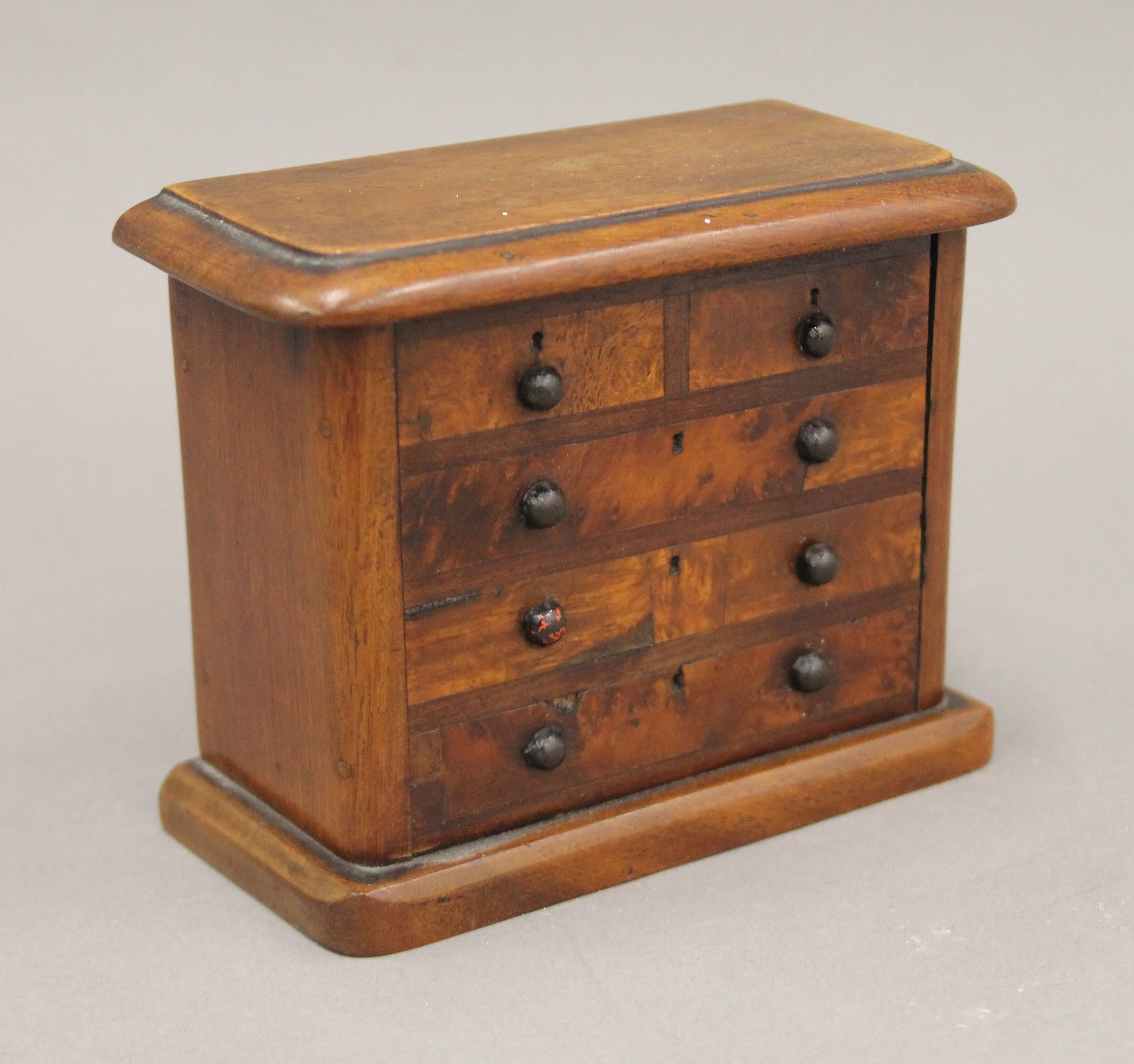 A money box formed as a Victorian chest of drawers. 12.5 cm wide. - Image 2 of 4