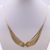 A 9 ct gold necklace. 45 cm long. 11.8 grammes.