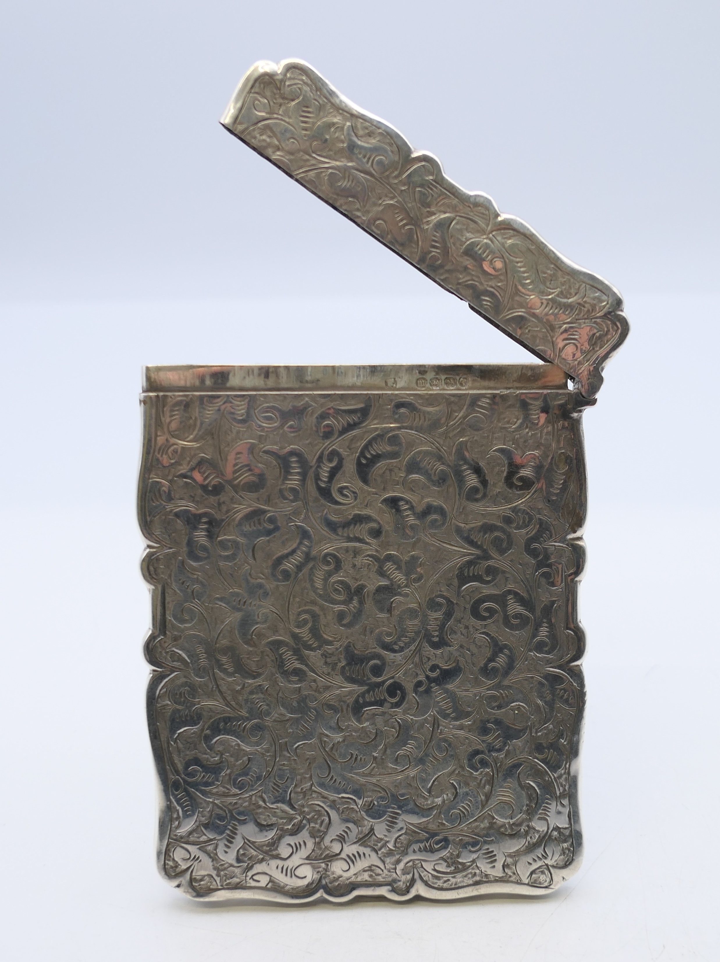 A silver card case, hallmarked for Birmingham 1886. 10 cm x 7 cm. 49.2 grammes. - Image 5 of 7