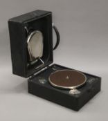 A vintage portable gramophone. 31 cm long.
