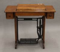 A Singer sewing machine table (lacking sewing machine). 86 cm long.