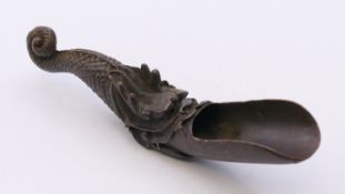 A bronze dragon form scoop. 12 cm long.