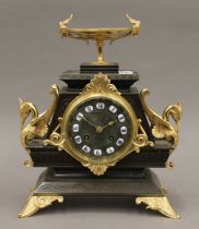 A 19th century gilt metal mounted bronze eight-day mantle clock. 28.5 cm high.