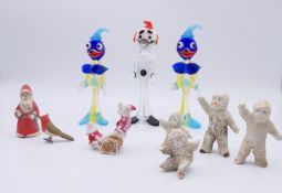 A small collection of Christmas cake ornaments and small glass clowns. Father Christmas 5 cm high.