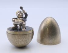 A Stuart Devlin silver gilt 'Little Jack Horner' egg. 7 cm high. 132.6 grammes.