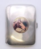 A silver cigarette case decorated with a horse. 8 cm x 6 cm. 50.4 grammes total weight.