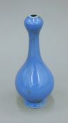 A Chinese blue ground porcelain garlic top vase. 16.5 cm high.