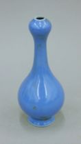 A Chinese blue ground porcelain garlic top vase. 16.5 cm high.