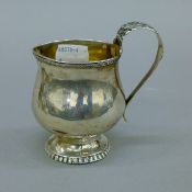 A Georgian silver cream jug, hallmarked 1824. 9.5 cm high. 105.6 grammes.