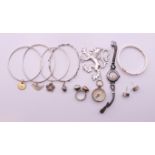 A quantity of silver jewellery, including bangles, brooch, earrings, etc. Lion brooch 6 cm high.