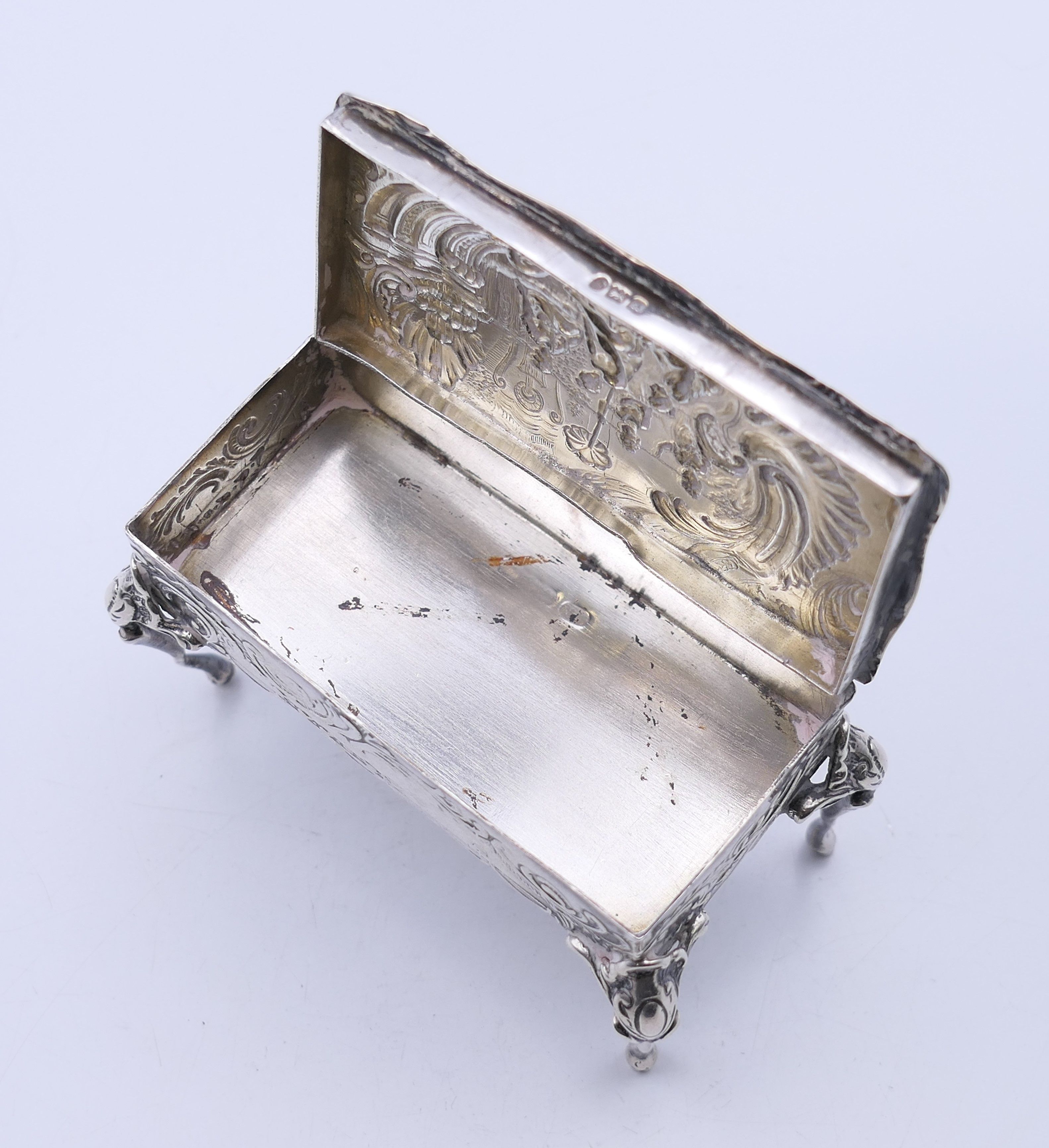 An embossed silver trinket box formed as a table, import marks for London 1899. - Image 8 of 11