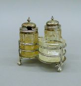 A Victorian silver cruet stand, hallmarked 1874. 8.5 cm high.