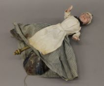 An unusual Victorian papier mache folding doll. 36 cm high.