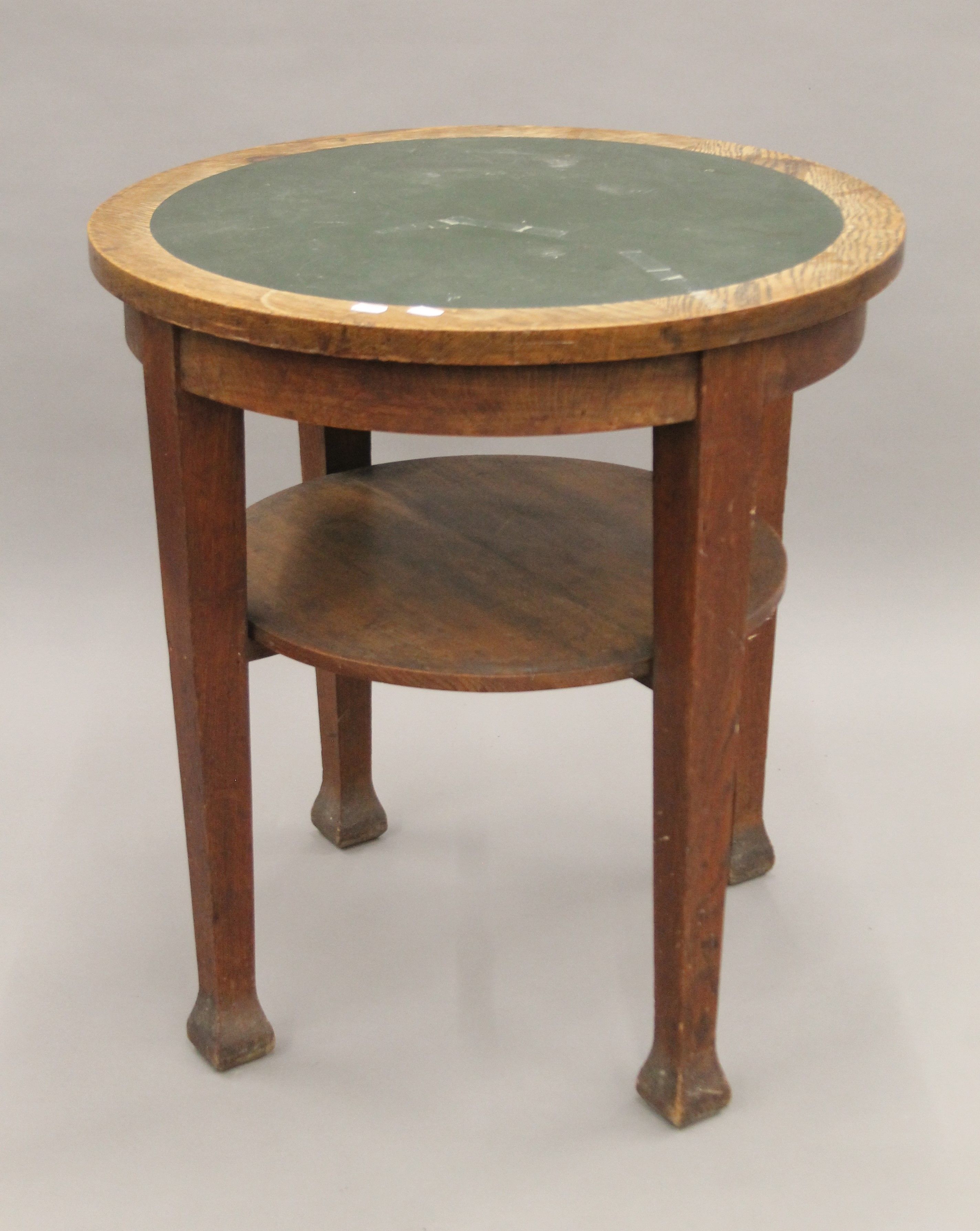 An early 20th century oak pub table. 67 cm diameter.