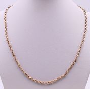A thin 9 ct gold chain with plated clasp. 47 cm long. 10 grammes total weight.