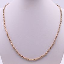 A thin 9 ct gold chain with plated clasp. 47 cm long. 10 grammes total weight.