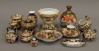 A collection of small Royal Crown Derby porcelain items, including teapots, vases, dishes, etc.