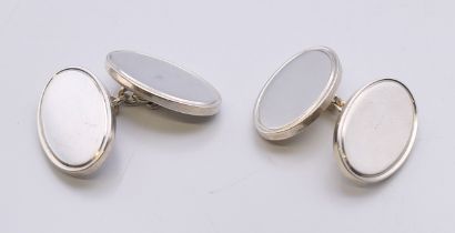 A pair of Garrard & Co silver cufflinks, in a Garrard's box. 2 cm x 1.5 cm.