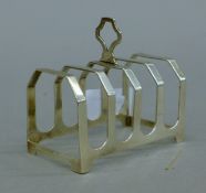 A silver toast rack. 7.5 cm long. 49.1 grammes.