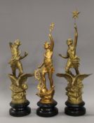 Three gilt painted spelter figures. The largest 53.5 cm high.