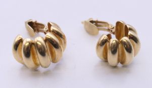 A pair of 14 ct gold Tiffany earrings. 2 cm high. 15.2 grammes.