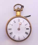 A gold plated pocket watch, housed in a wooden box stand. Watch 4.5 cm diameter, stand 7.