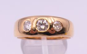 A Victorian three stone diamond gypsy set ring. Ring size S/T. Total diamond weight approximately 0.