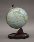 A vintage Chad Valley tin globe. 28 cm high.