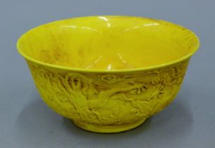A Chinese yellow ground porcelain bowl. 15 cm diameter.