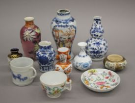 Eleven various Chinese and Japanese vases, etc. The largest 15 cm high.
