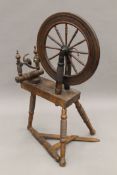 A 19th century spinning wheel. 108 cm high.