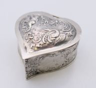 A silver heart shaped pill box, import marks for London 1897. 5.5 cm wide. 58.3 grammes.