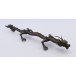 A bronze model of a dragon. 16 cm long.