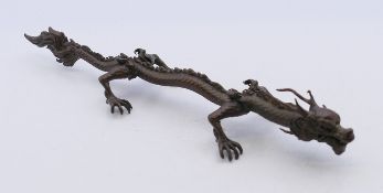 A bronze model of a dragon. 16 cm long.