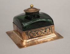 An Arts and Crafts copper and green glass inkwell. 12.5 cm square.