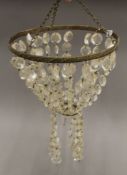 A glass drop chandelier. 25 cm diameter.
