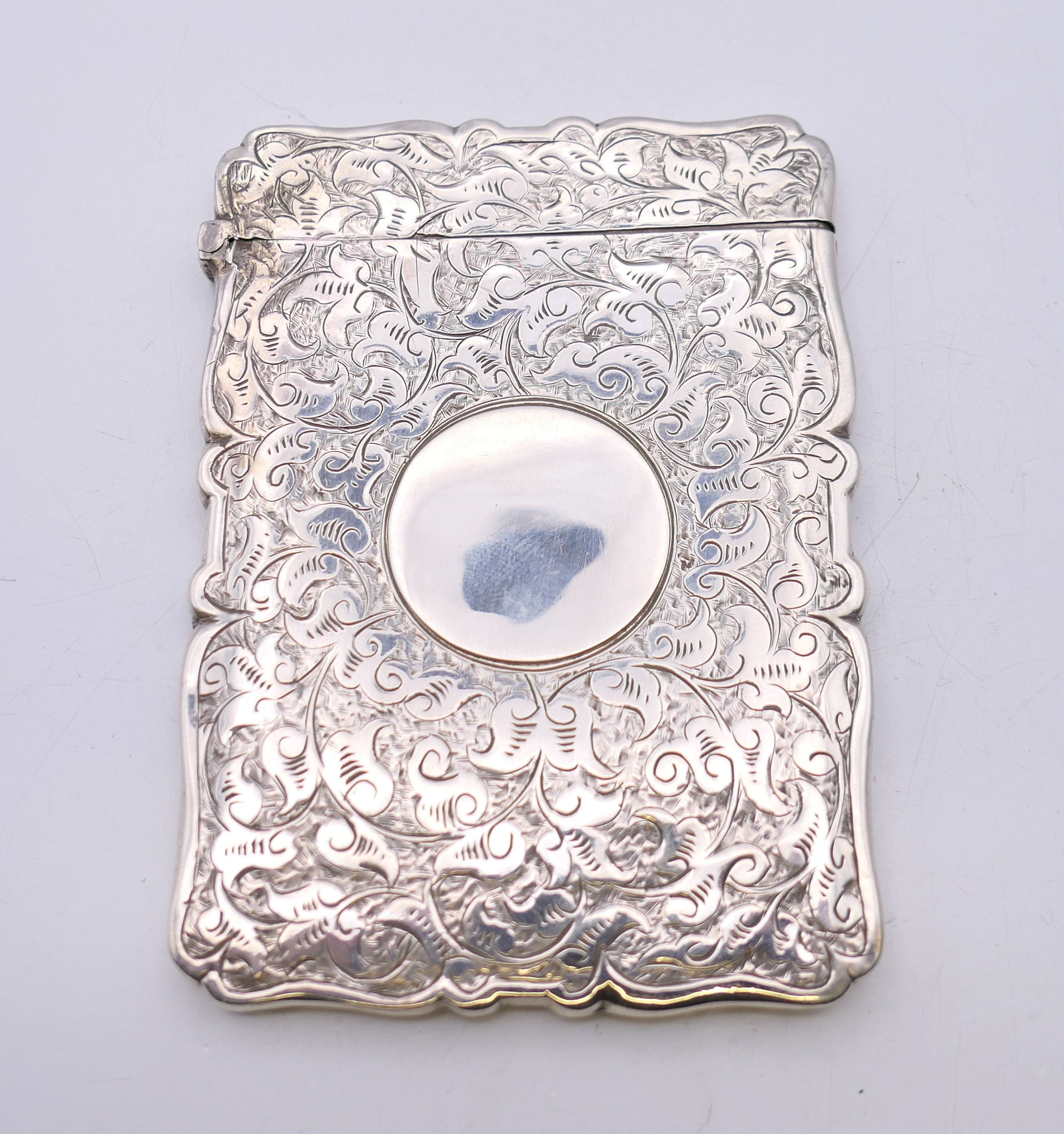 A silver card case, hallmarked for Birmingham 1886. 10 cm x 7 cm. 49.2 grammes. - Image 2 of 7