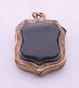 An antique bloodstone locket. 2.5 cm high.