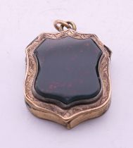 An antique bloodstone locket. 2.5 cm high.