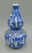 A Chinese blue and white porcelain double gourd vase. 39.5 cm high.