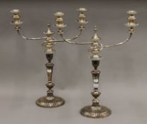 A pair of silver plated candelabra. 55 cm high.